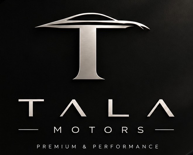 El rètol de Tala Motors: la T d'acer sobre una paret negra